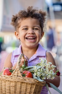 Little Girl Carrying a May Day Basket
