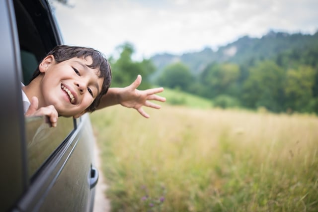 Child excited to go on a Topeka Day trip