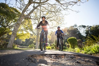 Two people enjoying the Topeka trails on their bikes Two people enjoying the Topeka trails on their bikes